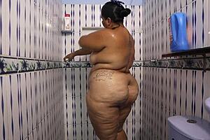 This milf in shower shows huge tits and big ass so hot