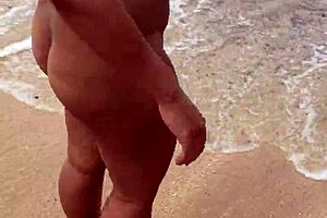 Bold asian wife flaunts big tits nude on beach