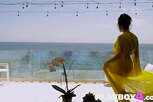 Big tits latina milf cj sparxx strips yellow clothes outdoors in sexy pose.