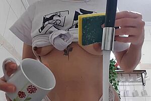 sexy latina maid washes dishes with huge tits bouncing out