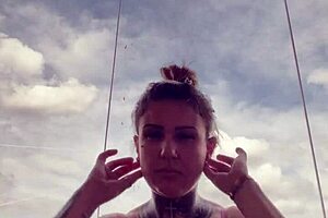 tattooed chick's hard nipples pop through see-through gym top