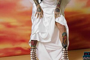 busty tattooed milf joanna angel strips luscious body for playboy