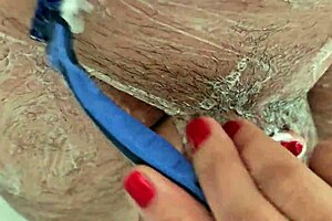 Watch her shave his cock and balls smooth in super close fetish POV