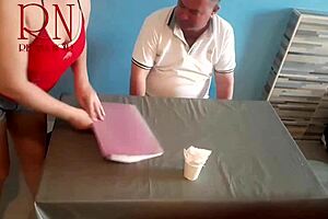 Naked waitress serves food from her navel to guest.