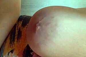 Blonde milf camgirl reveals huge natural tits and big pussy lips in solo series