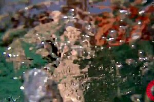 Samantha Rones fingers pussy underwater in close-up solo scenes with clit play