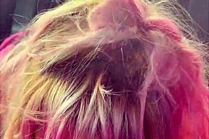 pretty girl kneels in car backseat for a deep oral session outdoors