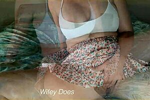 Wife fingers her smooth shaved pussy on bed