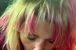 pretty girl kneels in car backseat for a deep oral session outdoors