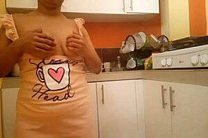 Step mom with big ass and busty tits fingers her wet pussy right in the kitchen now.