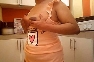 Step mom with big ass and busty tits fingers her wet pussy right in the kitchen now.