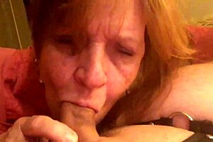 Granny Carmen moans while sucking hard cock