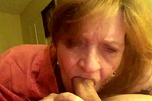 Granny Carmen moans while sucking hard cock