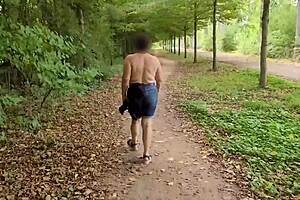 A busty milf goes topless outdoors flashing her curves