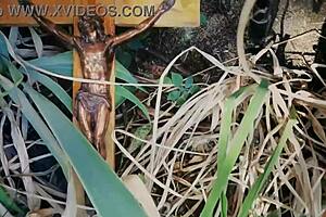 Naked beauty adores the crucifix