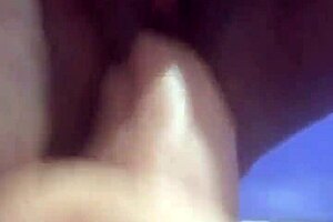 A mature milf enjoys solo play with her dildo.